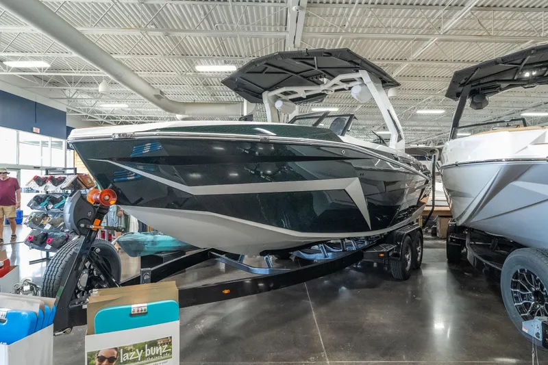 Slide: The Image of 2026 Tigé Z3 boat displayed indoors on a trailer, showcasing sleek design and modern features. - 4