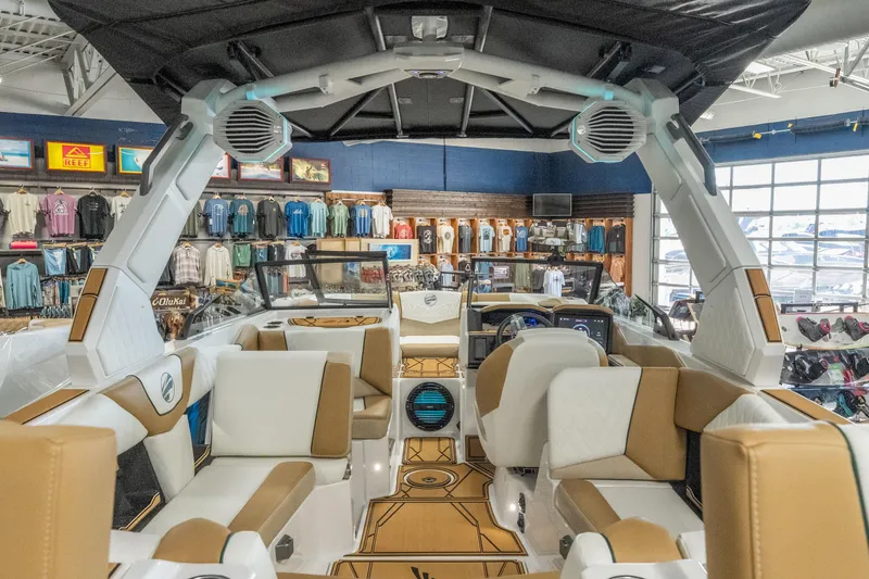Slide: The Image of 2026 Tigé Z3 boat interior with luxury seating and advanced audio system in showroom. - 40