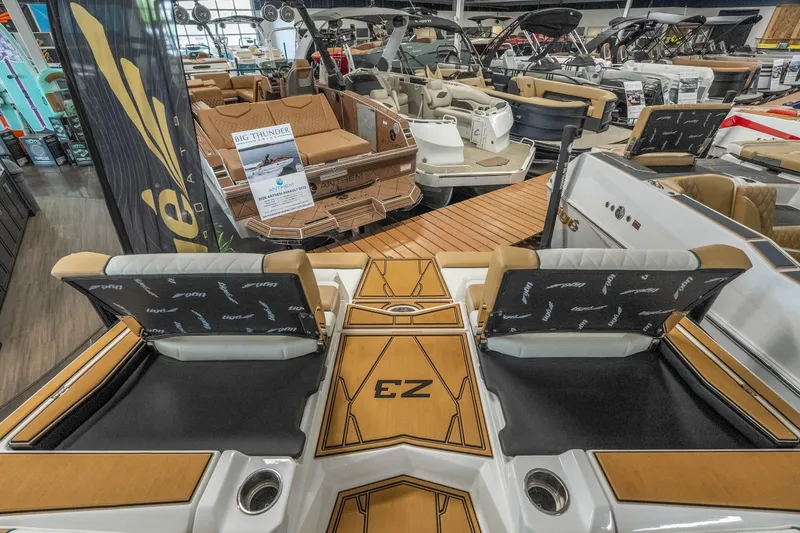 Slide: The Image of 2026 Tigé Z3 boat interior at a showroom, featuring luxurious seating and modern design. - 42
