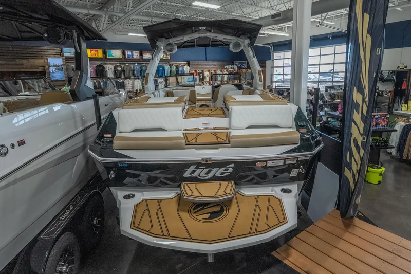 Slide: The Image of 2026 Tigé Z3 boat displayed in a showroom, featuring luxurious seating and modern design. - 6