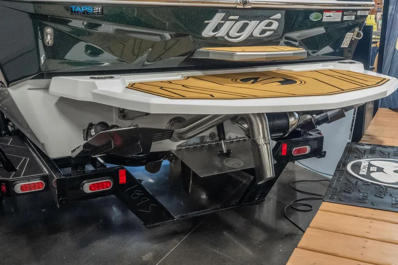Slide: The Image of 2026 Tigé Z3 boat rear view with swim platform and TAPS 3T technology. - 7