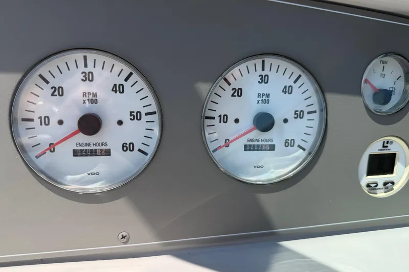 Slide: The Image of Dashboard of a 2000 Formula 330 Sun Sport with RPM and fuel gauges. - 14