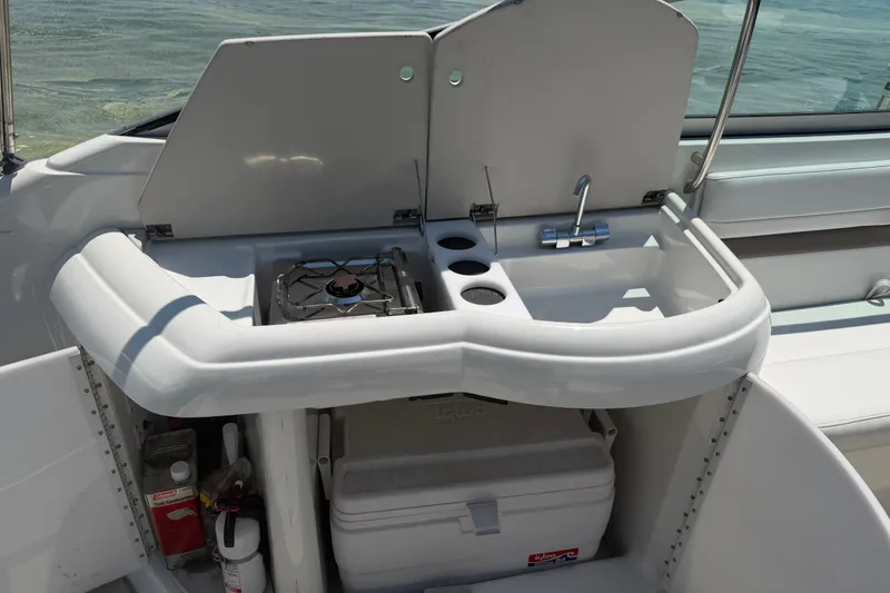 Slide: The Image of Outdoor kitchenette on a 2000 Formula 330 Sun Sport boat with stove and sink. - 15