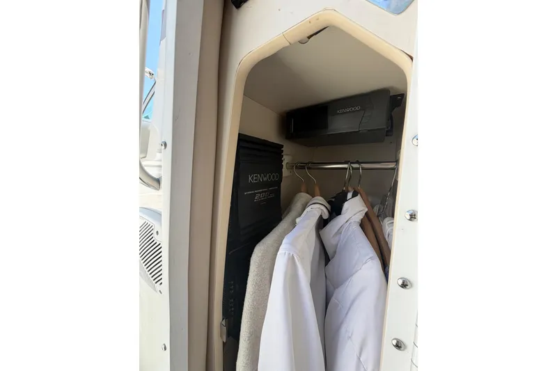Slide: The Image of Closet inside 2000 Formula 330 Sun Sport boat with Kenwood audio equipment. - 16