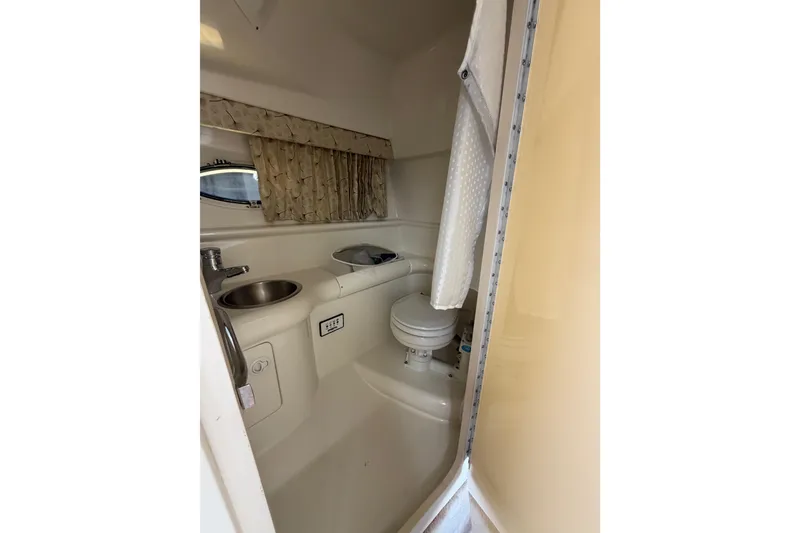 Slide: The Image of Interior of 2000 Formula 330 Sun Sport boat bathroom with sink and toilet. - 18