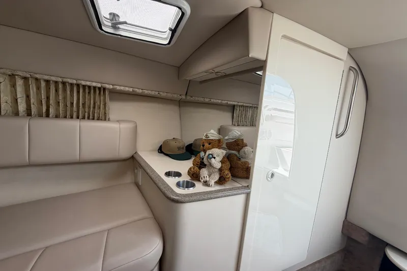 Slide: The Image of Interior of 2000 Formula 330 Sun Sport boat with plush toys and hats on counter. - 19