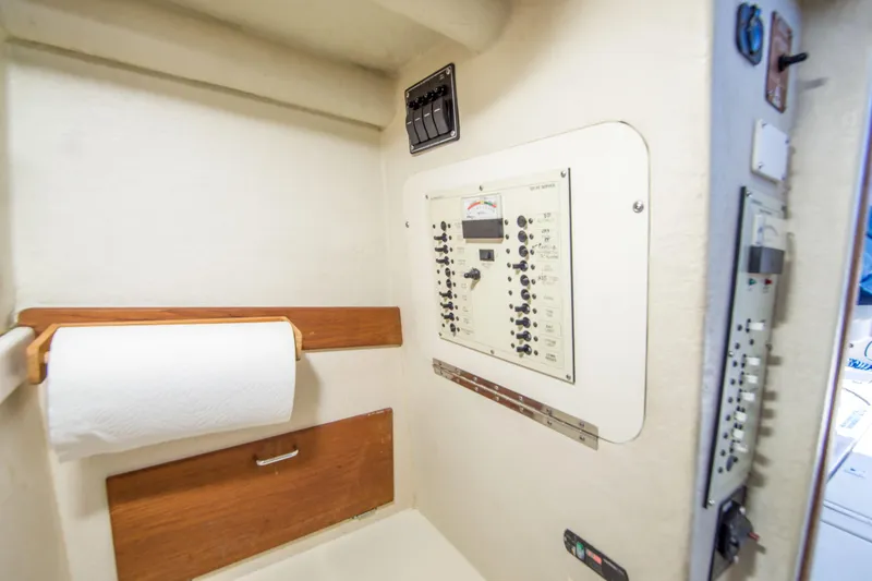 Slide: The Image of Electrical panel in 2009 Blackman Pilothouse boat interior with paper towel holder. - 24