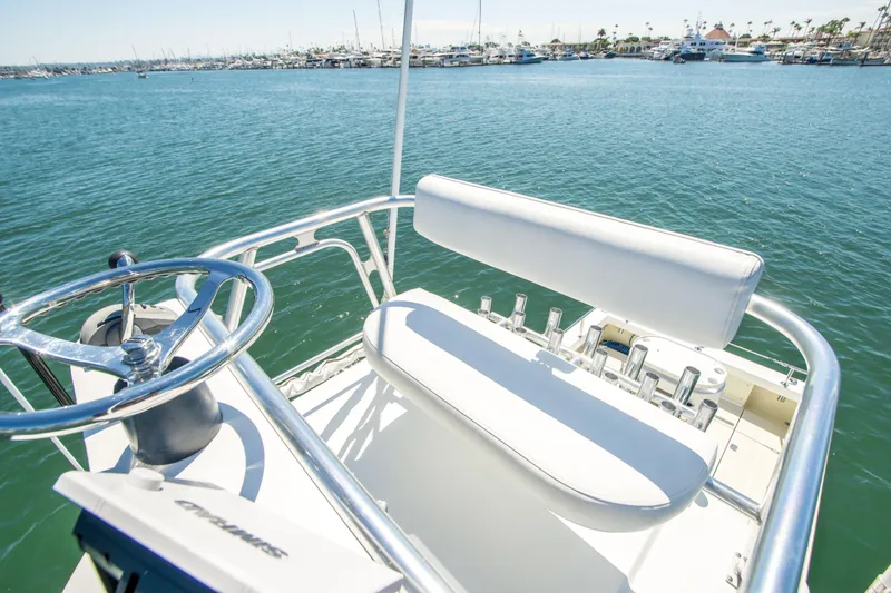 Slide: The Image of 2009 Blackman Pilothouse boat helm with steering wheel and ocean view. - 12