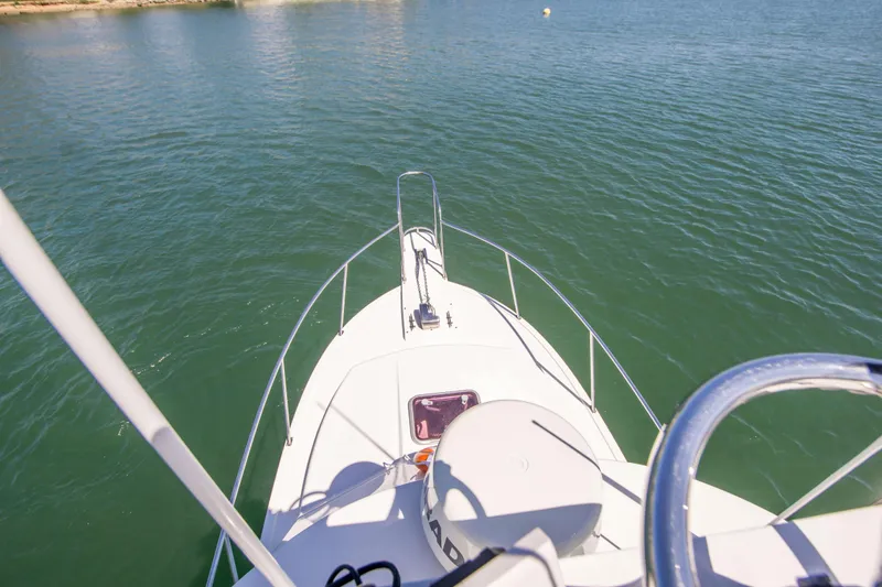Slide: The Image of Bow view of 2009 Blackman Pilothouse boat on calm water. - 11