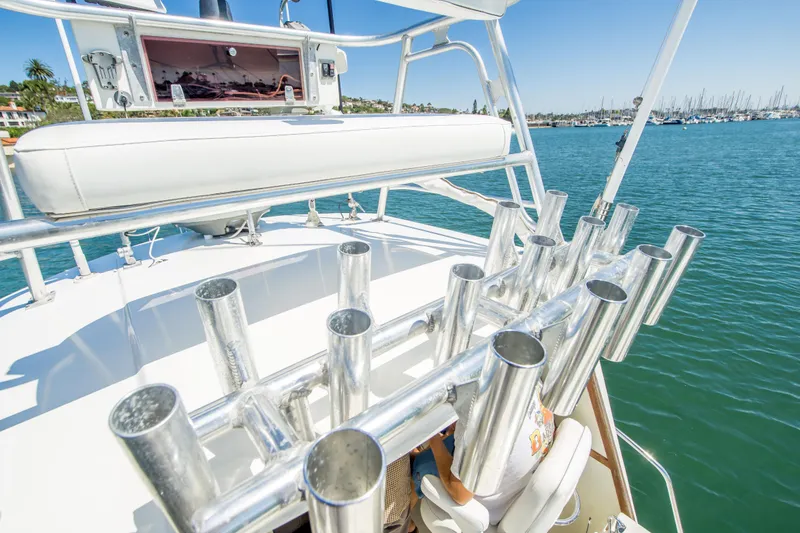 Slide: The Image of 2009 Blackman Pilothouse boat with rod holders on a sunny day at the marina. - 13