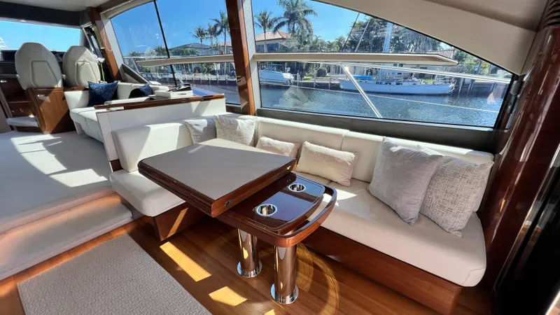 Slide: The Image of Luxurious 2019 Princess F62 yacht interior with elegant seating and waterfront view. - 10