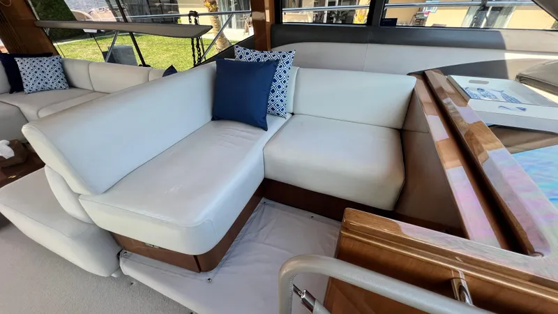 Slide: The Image of Luxurious interior seating on a 2019 Princess F62 yacht with elegant cushions. - 16