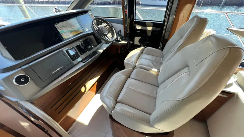 Slide: The Image of Luxurious 2019 Princess F62 yacht cockpit with leather seats and advanced navigation system. - 17