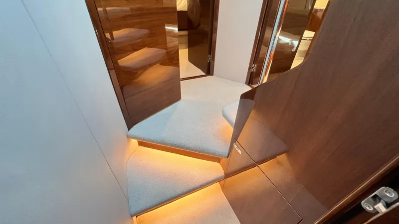 Slide: The Image of Luxurious interior staircase of 2019 Princess F62 yacht with elegant lighting. - 25