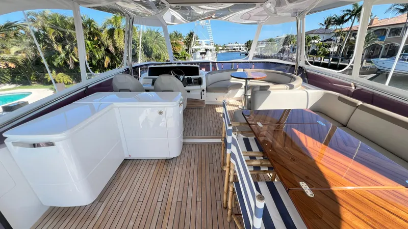 Slide: The Image of Luxurious 2019 Princess F62 yacht interior with elegant seating and wooden flooring. - 37