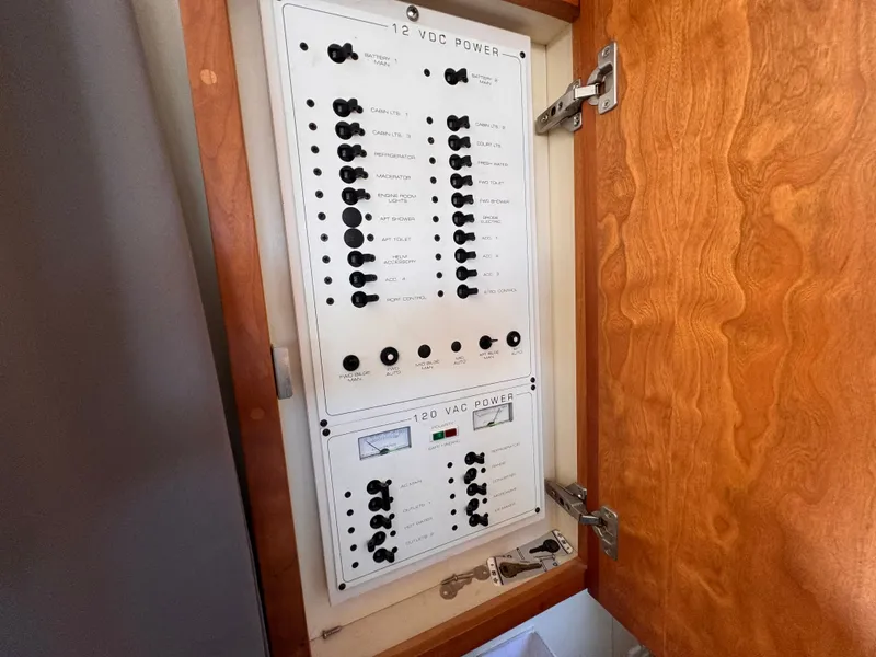Slide: The Image of Electrical control panel on a boat with wooden paneling. - 20