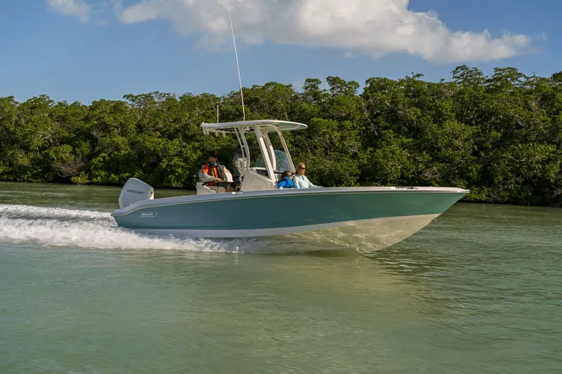 Slide: The Image of Boston Whaler 250 Dauntless from 2027 speeding through calm waters, surrounded by lush greenery. - 9
