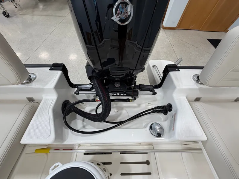 Slide: The Image of The image shows the engine area of a 2027 Boston Whaler 170 Montauk. - 26