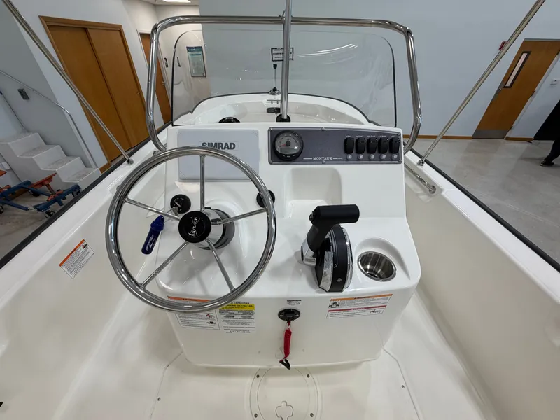 Slide: The Image of Helm of a Boston Whaler 170 Montauk with steering wheel and instruments. - 20