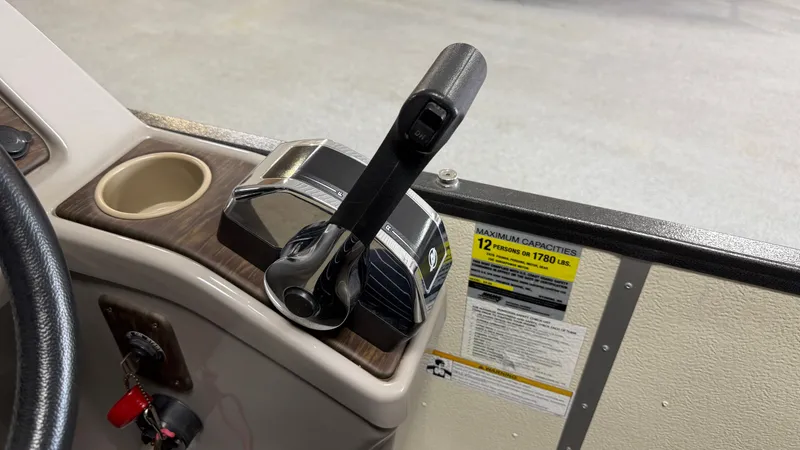 Slide: The Image of Close-up of the throttle and controls on a 2014 Premier 240 Sunsation SL. - 39