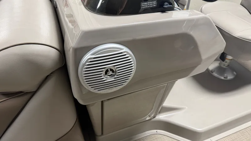 Slide: The Image of Close-up of a speaker on a boat, surrounded by beige upholstery. - 34