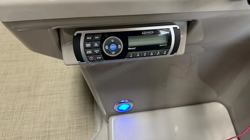 Slide: The Image of A helm console with a built-in radio and a blue LED light below. - 46
