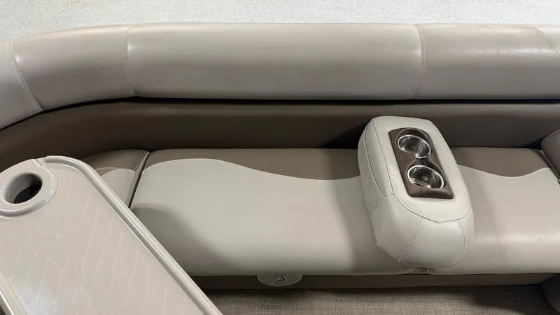 Slide: The Image of The 2014 Premier 240 Sunsation SL features a cushioned bench seat with built-in cup holders. - 16