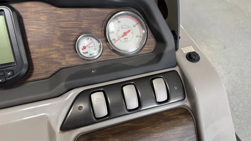 Slide: The Image of Dashboard of a 2014 Premier 240 Sunsation SL with gauges and switches. - 43