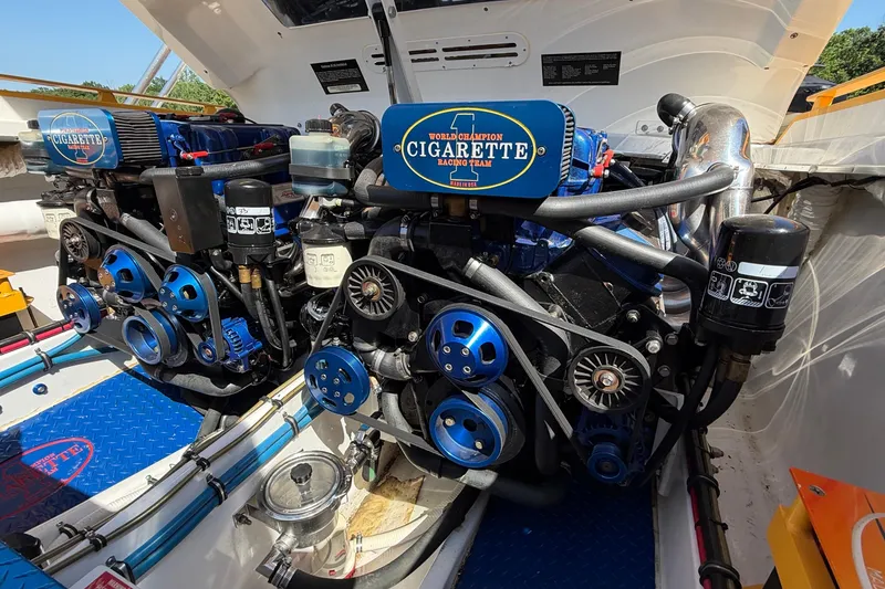 Slide: The Image of Engine compartment of a 2002 Cigarette 35' Cafe Racer boat, showcasing dual engines. - 20