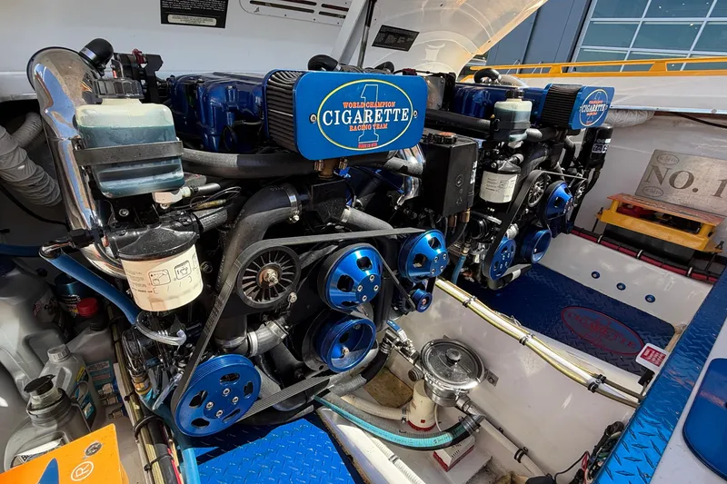 Slide: The Image of Engine compartment of a 2002 Cigarette 35' Cafe Racer boat, showcasing dual engines. - 21