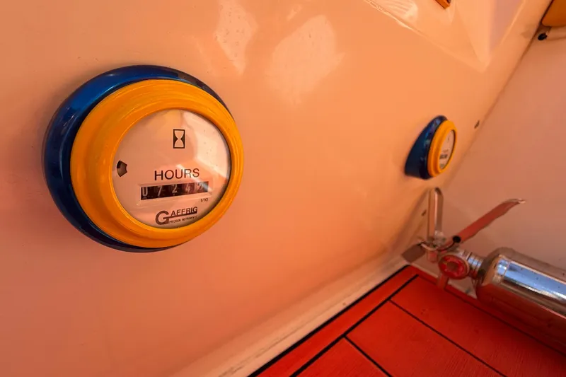 Slide: The Image of Hour meter and fire extinguisher on 2002 Cigarette 35' Cafe Racer boat. - 25