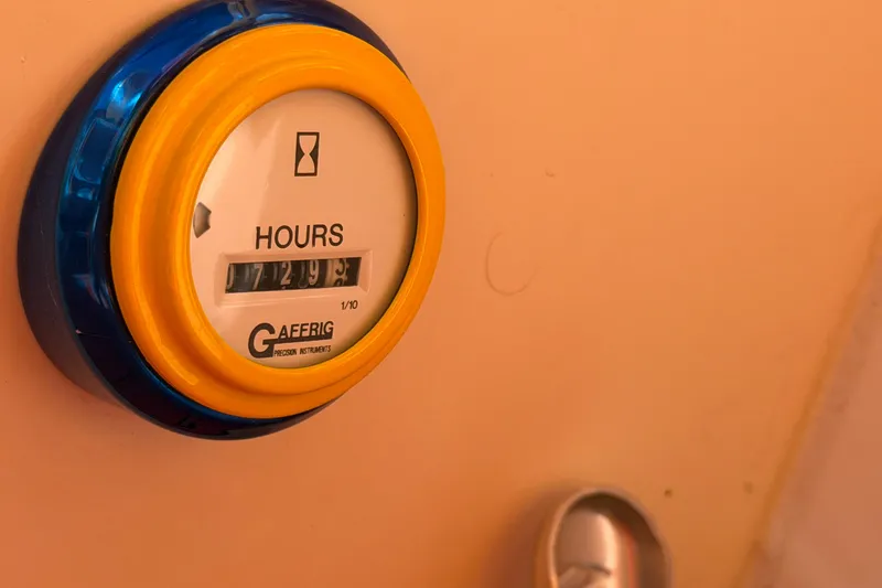 Slide: The Image of Hour meter on 2002 Cigarette 35' Cafe Racer boat dashboard, displaying 729.3 hours. - 26