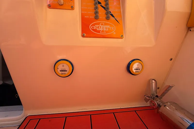 Slide: The Image of Control panel of a 2002 Cigarette 35' Cafe Racer boat with gauges and fire extinguisher. - 31