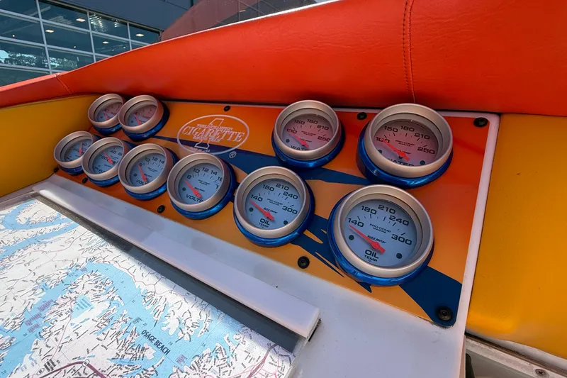 Slide: The Image of Dashboard of a 2002 Cigarette 35' Cafe Racer with gauges and map detail. - 34