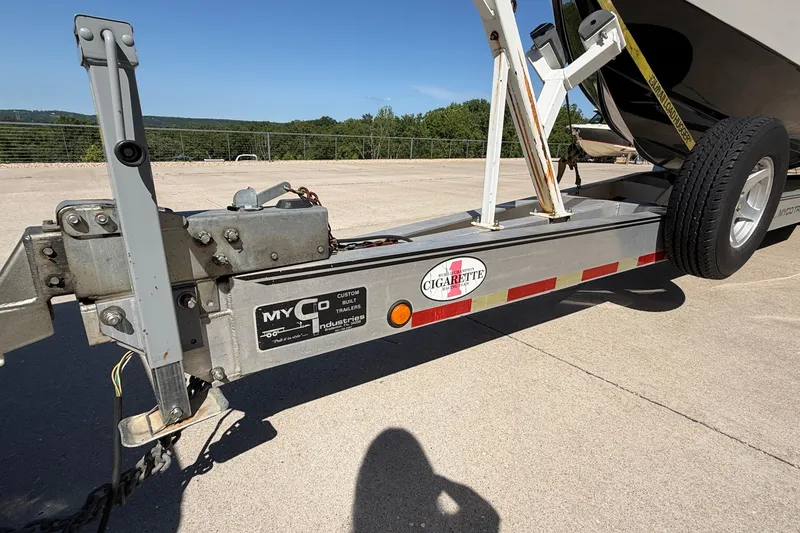 Slide: The Image of Trailer for 2002 Cigarette 35' Cafe Racer boat, featuring Myco Industries branding. - 48