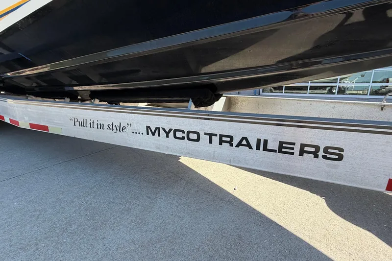 Slide: The Image of Trailer with "Pull it in style" slogan, supporting a 2002 Cigarette 35' Cafe Racer boat. - 50