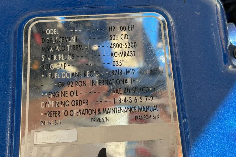 Slide: The Image of 2002 Cigarette 35' Cafe Racer engine specifications plate with maintenance details. - 53