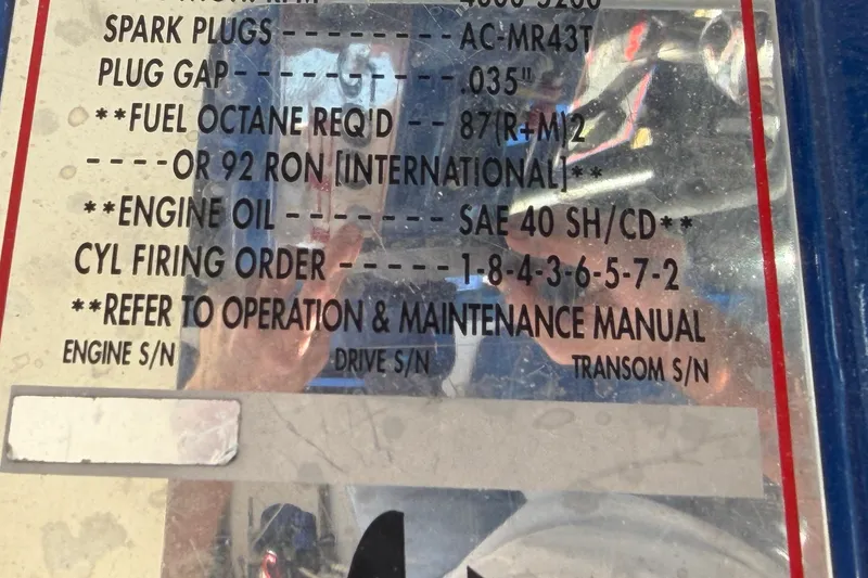 Slide: The Image of Instruction label for 2002 Cigarette 35' Cafe Racer, detailing engine specifications and maintenance. - 54