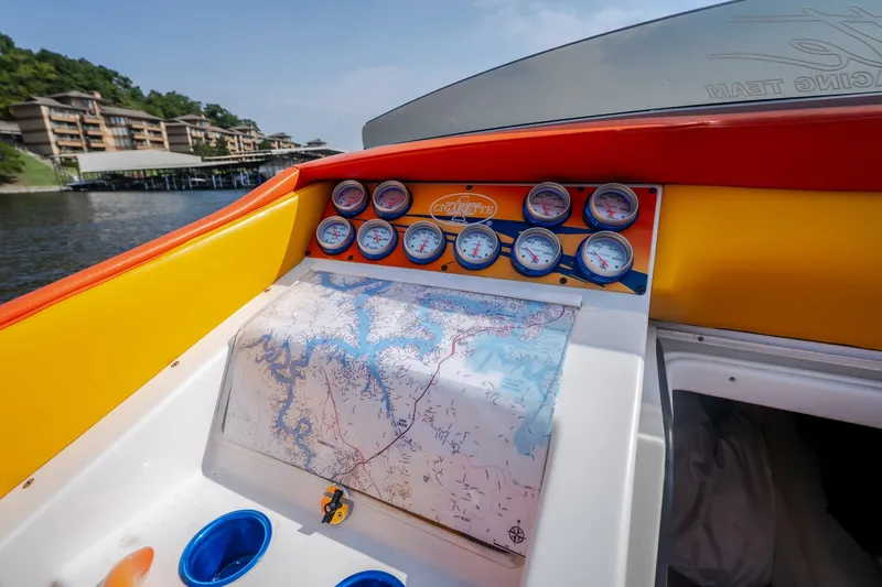Slide: The Image of Cockpit of 2002 Cigarette 35' Playboy Edition boat with gauges and map. - 34