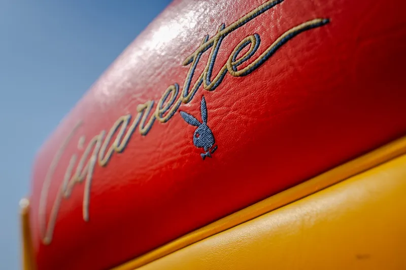 Slide: The Image of Red and yellow leather with "Cigarette" and Playboy logo, 2002 Cigarette 35' Playboy Edition. - 28