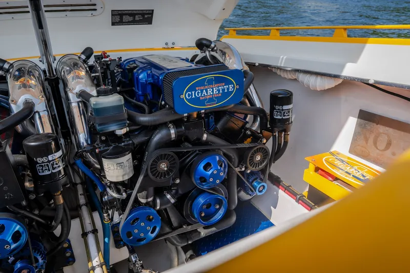 Slide: The Image of Engine of 2002 Cigarette 35' Playboy Edition boat, showcasing detailed mechanical components. - 15