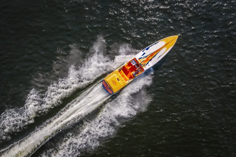 Slide: The Image of Aerial view of 2002 Cigarette 35' Playboy Edition speedboat on water. - 35