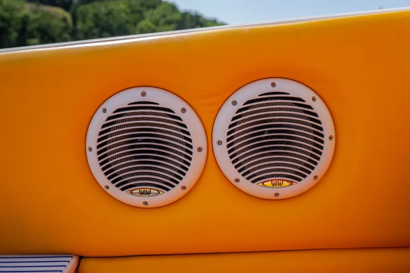Slide: The Image of Yellow interior with dual speakers on a 2002 Cigarette 35' Playboy Edition boat. - 29