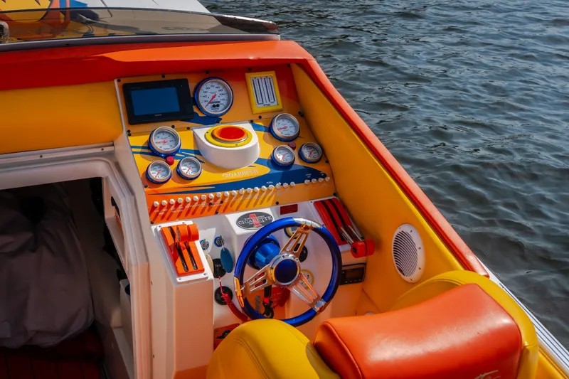 Slide: The Image of Colorful dashboard of a 2002 Cigarette 35' Playboy Edition boat on water. - 19