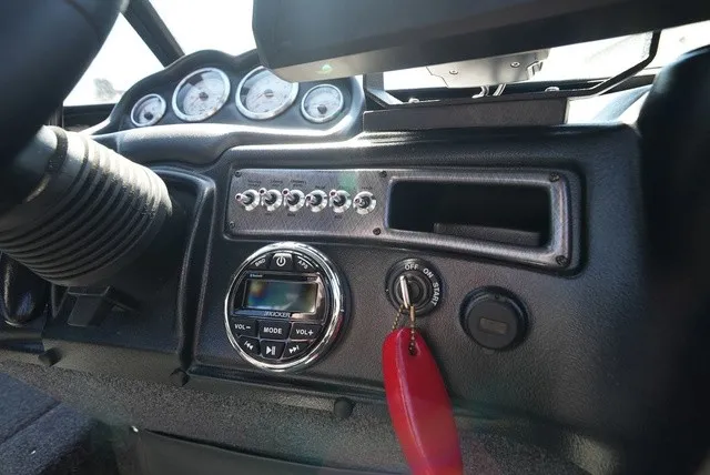 Slide: The Image of The dashboard of a 2024 Lund 2075 Fisherman with controls and instruments. - 34