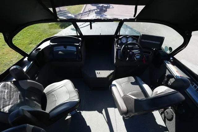 Slide: The Image of Interior view of a 2024 Lund 2075 Fisherman boat with four seats and a helm station. - 25
