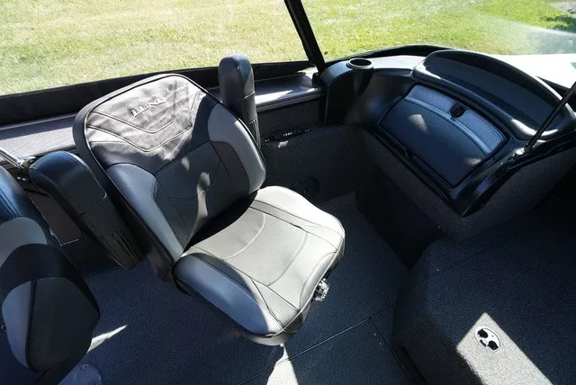 Slide: The Image of Interior of a 2024 Lund 2075 Fisherman with a cushioned seat and dashboard. - 26