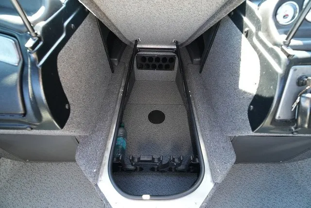 Slide: The Image of Interior view of a boat with gray carpeting and storage space for fishing rods. - 37