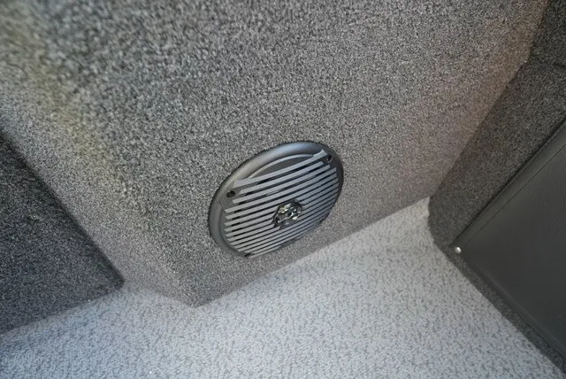 Slide: The Image of Close-up of a speaker in a gray, textured boat interior. - 30