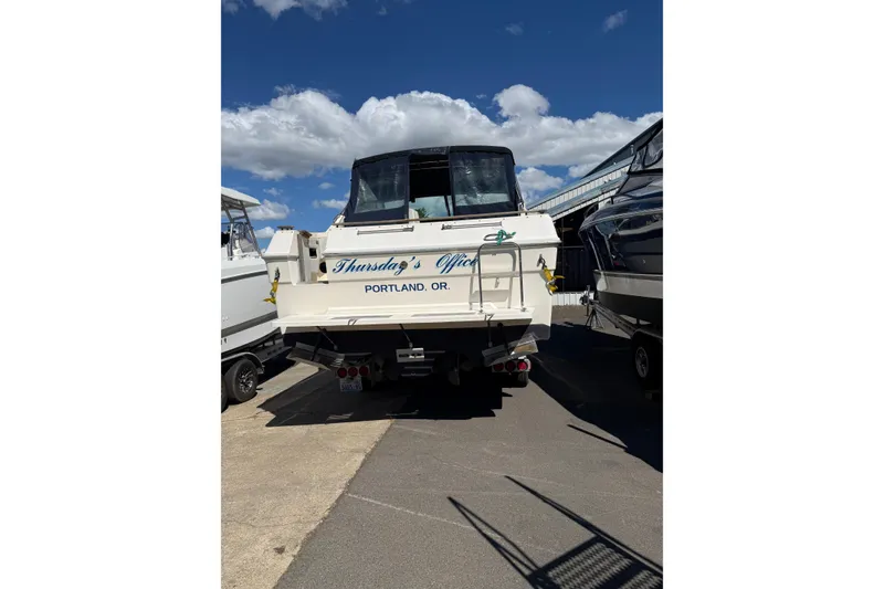 Slide: The Image of 1987 Sea Ray 300 Weekender boat docked, labeled "Thursday's Office," Portland, Oregon. - 18